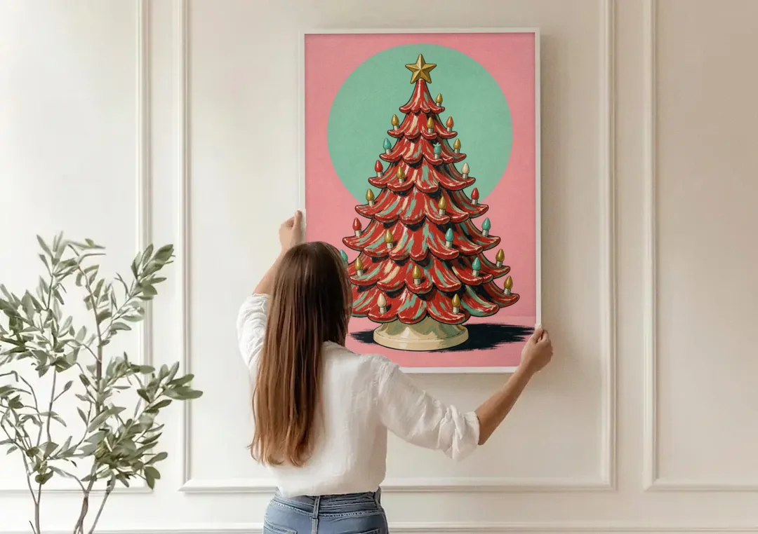 Nostalgic Christmas Wall Art with a Ceramic Tree canvas wall art being hung on a paneled wall