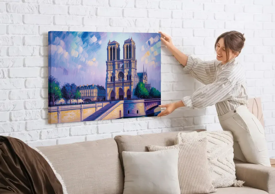 Notre Dame Silhouette canvas wall art being hung on a white brick wall above a sofa