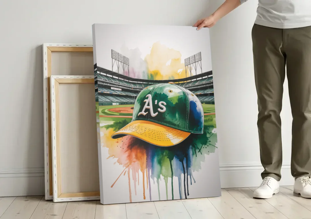 Oakland Athletics A Watercolor Tribute to Baseball Legacy canvas wall art leaning against a wall next to blank canvases