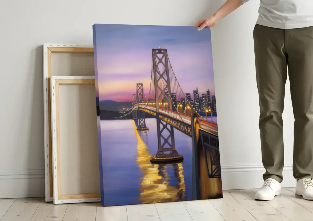 Oakland Bay Bridge View canvas wall art leaning against a wall next to blank canvases