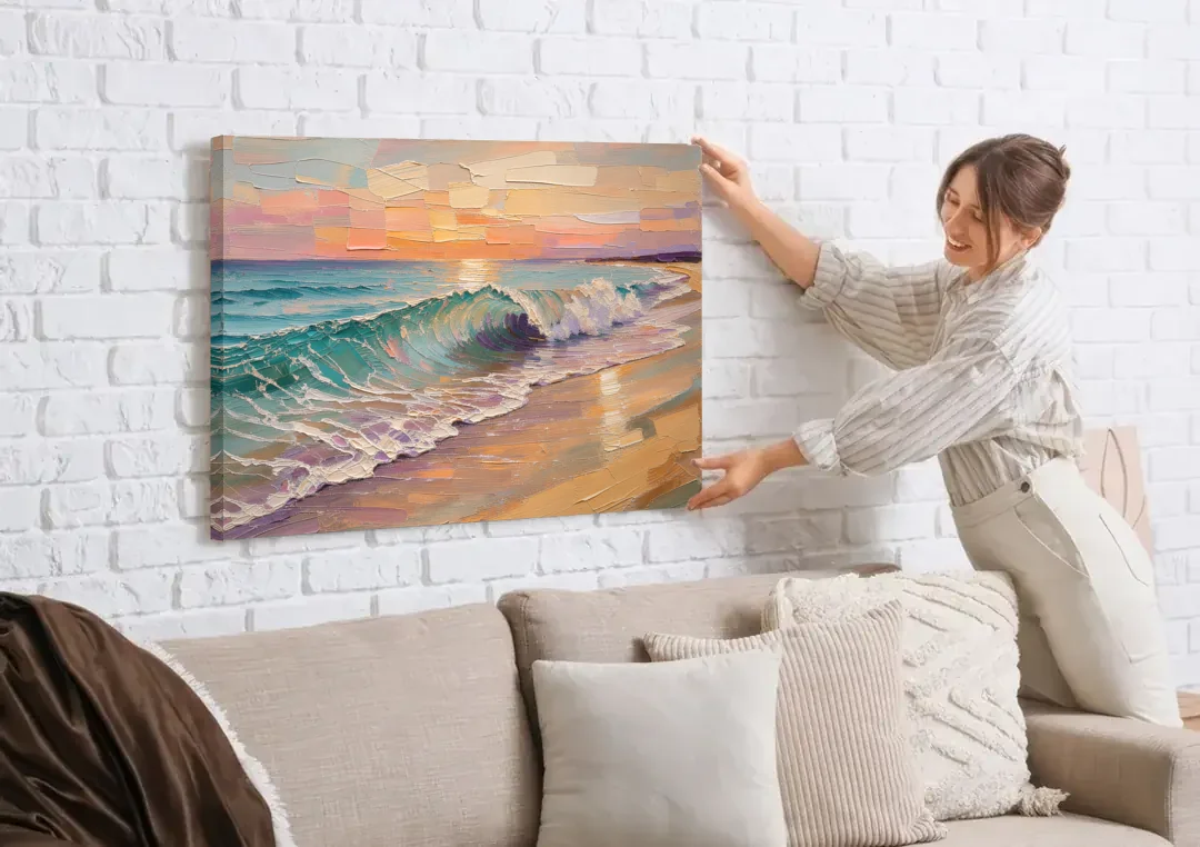 Ocean Wave Painting of a Sunset Curl canvas wall art being hung on a white brick wall above a sofa
