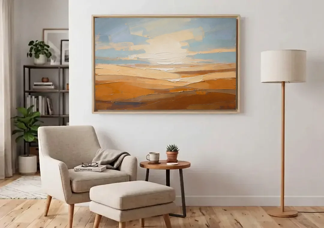 Ochre Desert Horizon at First Light canvas wall art above an armchair in a bright living room