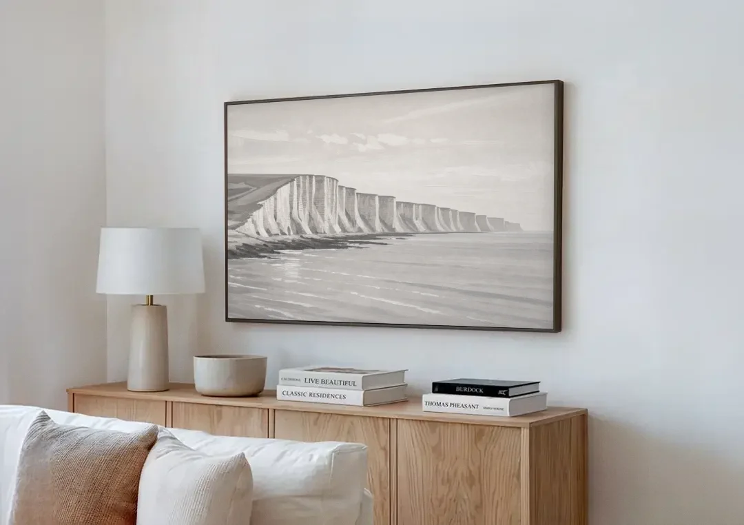 Office Art Prints Chalk Cliffs Above a Calm Sea canvas wall art above a wooden sideboard next to a sofa