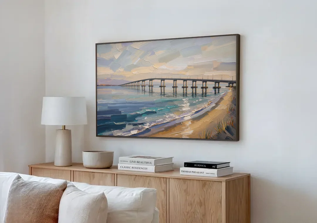 Office Canvas Wall Art of a Long Bay Bridge canvas wall art above a wooden sideboard next to a sofa