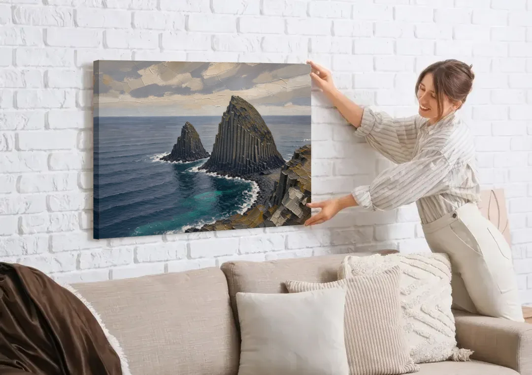 Office Paintings Basalt Sea Stacks Off the Cliff canvas wall art being hung on a white brick wall above a sofa