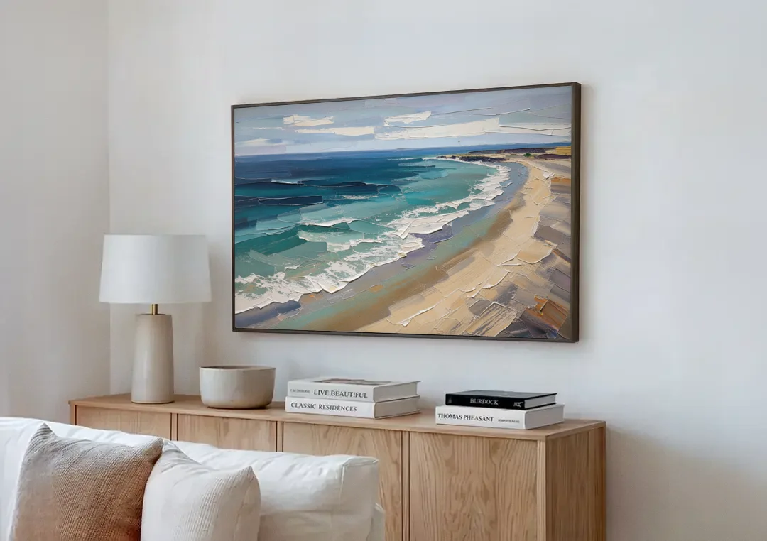 Office Wall Decor with Surf Curving Along Sand canvas wall art above a wooden sideboard next to a sofa