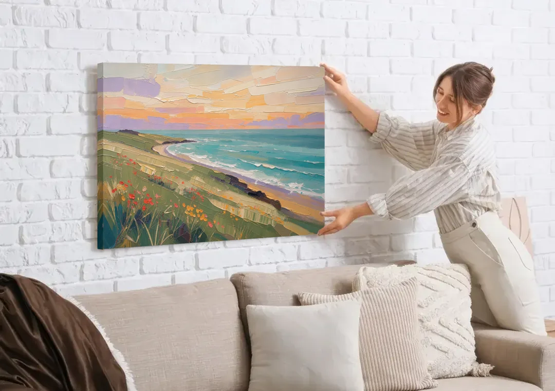 Oil Painting Landscape Canvas of a Sage Headland canvas wall art being hung on a white brick wall above a sofa