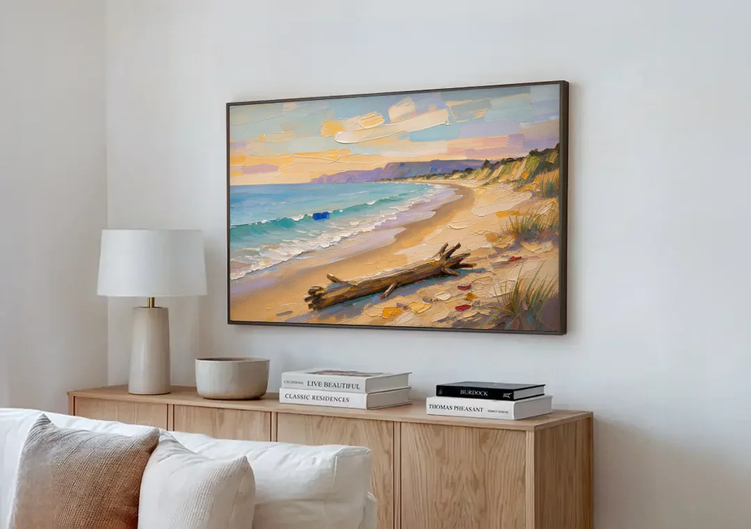 Oil Painting of Beach and Lone Driftwood canvas wall art above a wooden sideboard next to a sofa