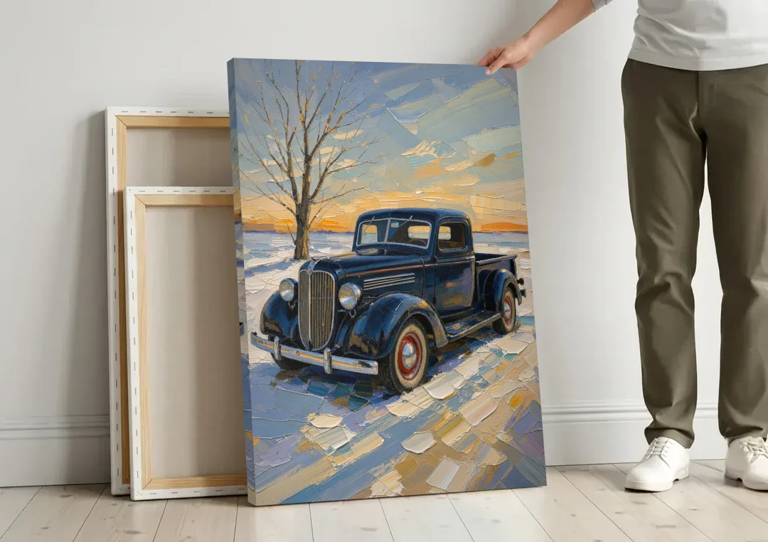 Old Truck Wall Art by the Bare Winter Tree canvas wall art leaning against a wall next to blank canvases