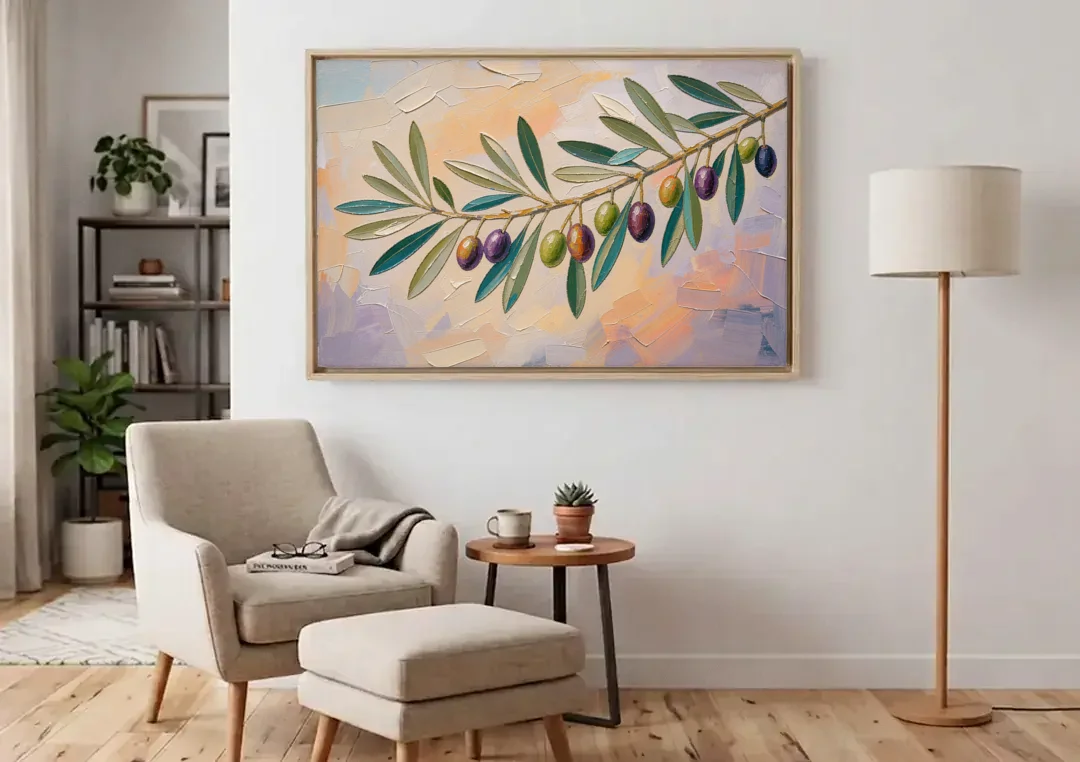 Olive Branch Painting in Pastel Light canvas wall art above an armchair in a bright living room