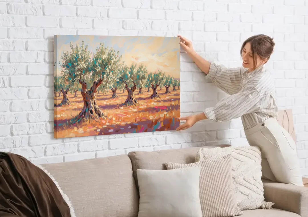 Olive Grove Painting in Late Afternoon canvas wall art being hung on a white brick wall above a sofa