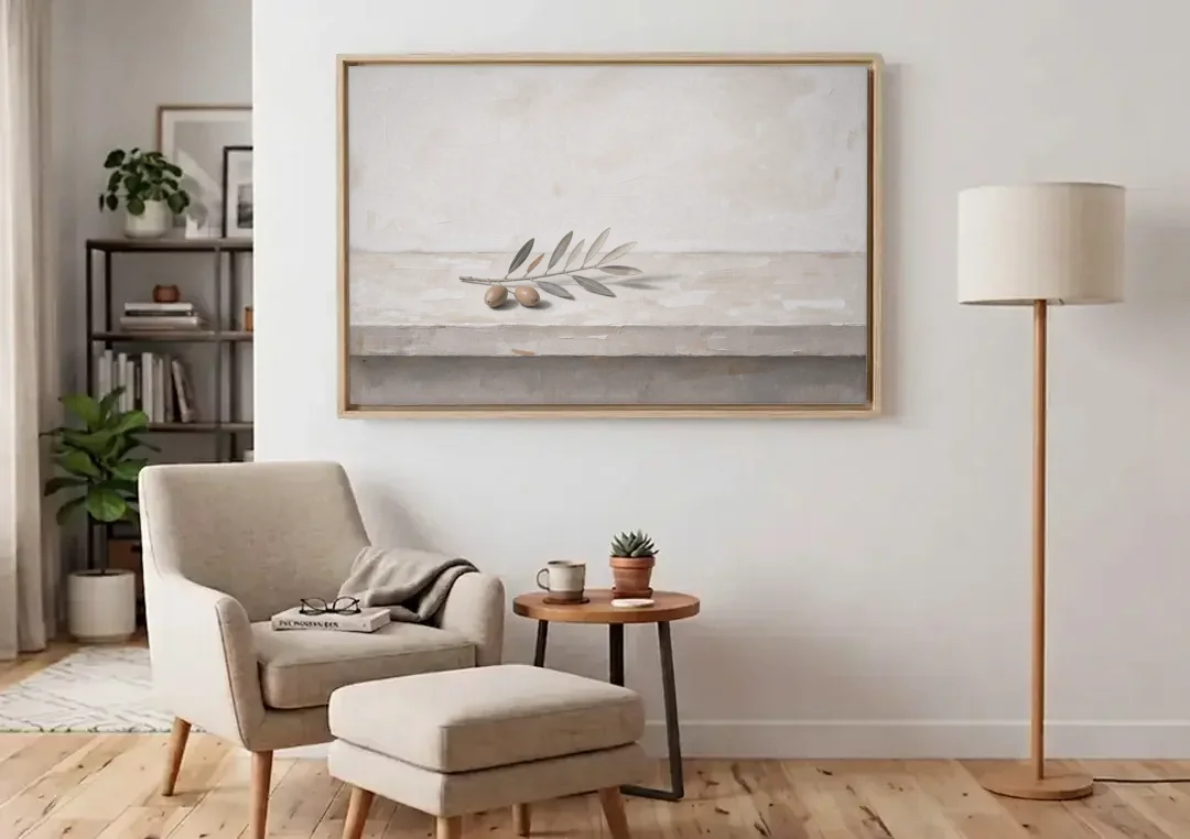 Olive Sprig on a Whitewashed Plaster Ledge canvas wall art above an armchair in a bright living room