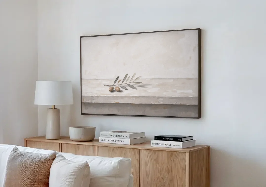 Olive Sprig on a Whitewashed Plaster Ledge canvas wall art above a wooden sideboard next to a sofa