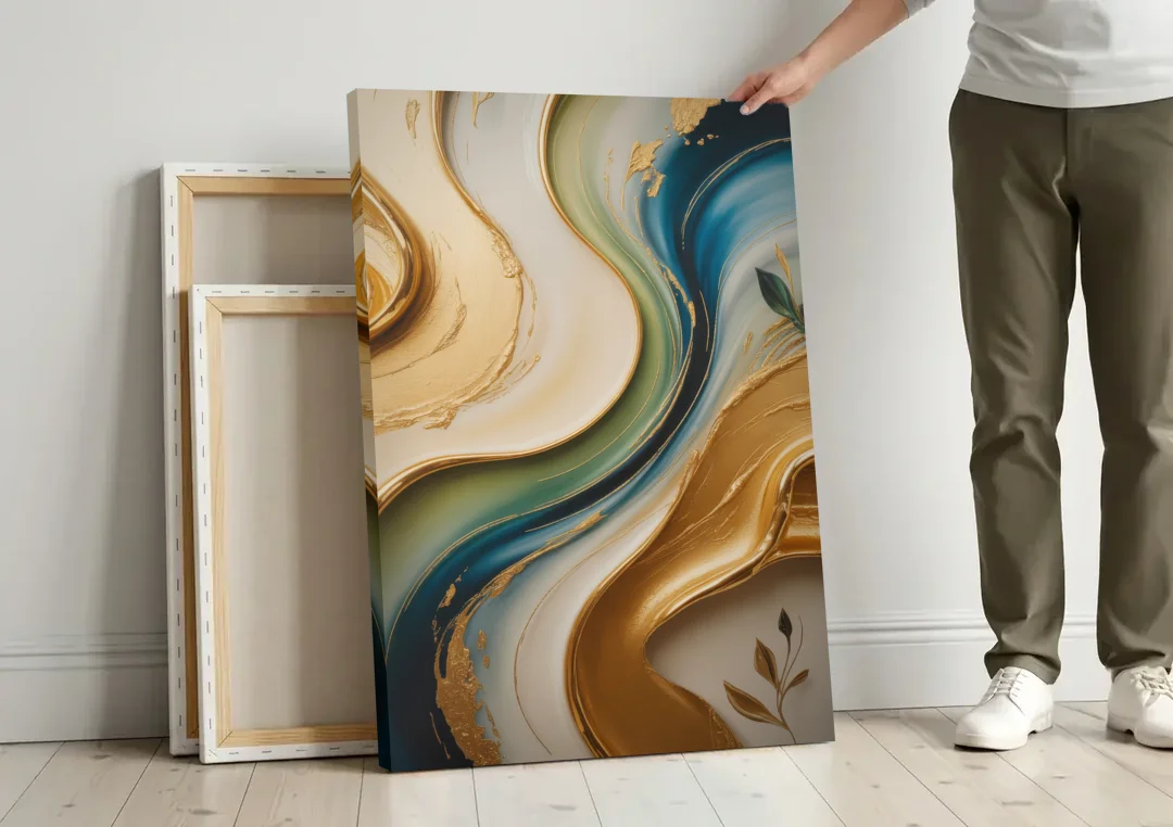 Opulent Flowing Forms Gold Abstract canvas wall art leaning against a wall next to blank canvases