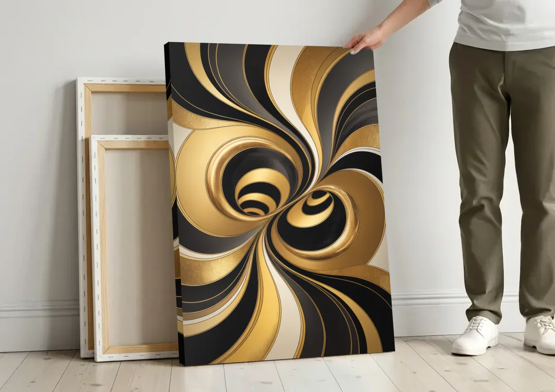 Opulent Fluidity in Black and Gold Abstract canvas wall art leaning against a wall next to blank canvases