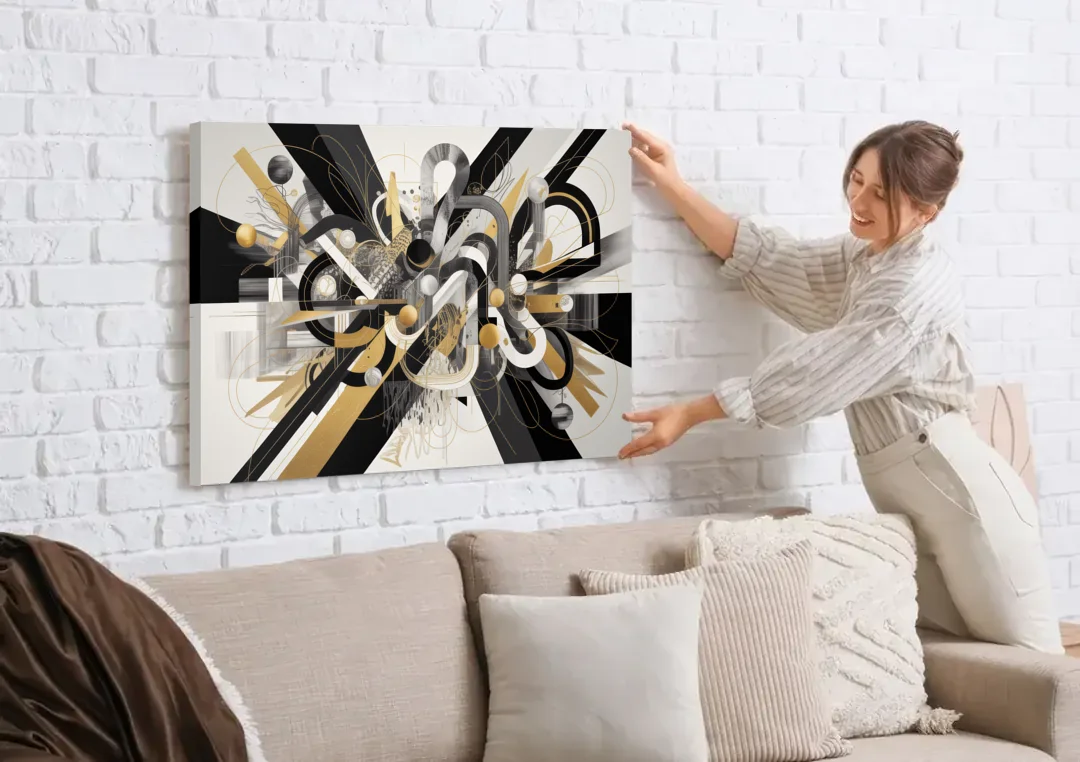 Opulent Geometric Dance Black White and Gold Abstract canvas wall art being hung on a white brick wall above a sofa