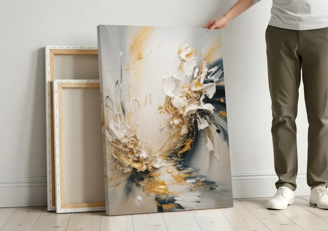 Opulent Gestures White and Gold canvas wall art leaning against a wall next to blank canvases