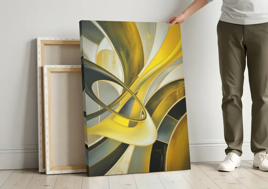 Opulent Resonance Yellow and Grey Abstract canvas wall art leaning against a wall next to blank canvases