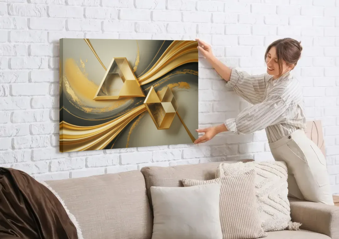 Opulent Streams Gold Abstract canvas wall art being hung on a white brick wall above a sofa
