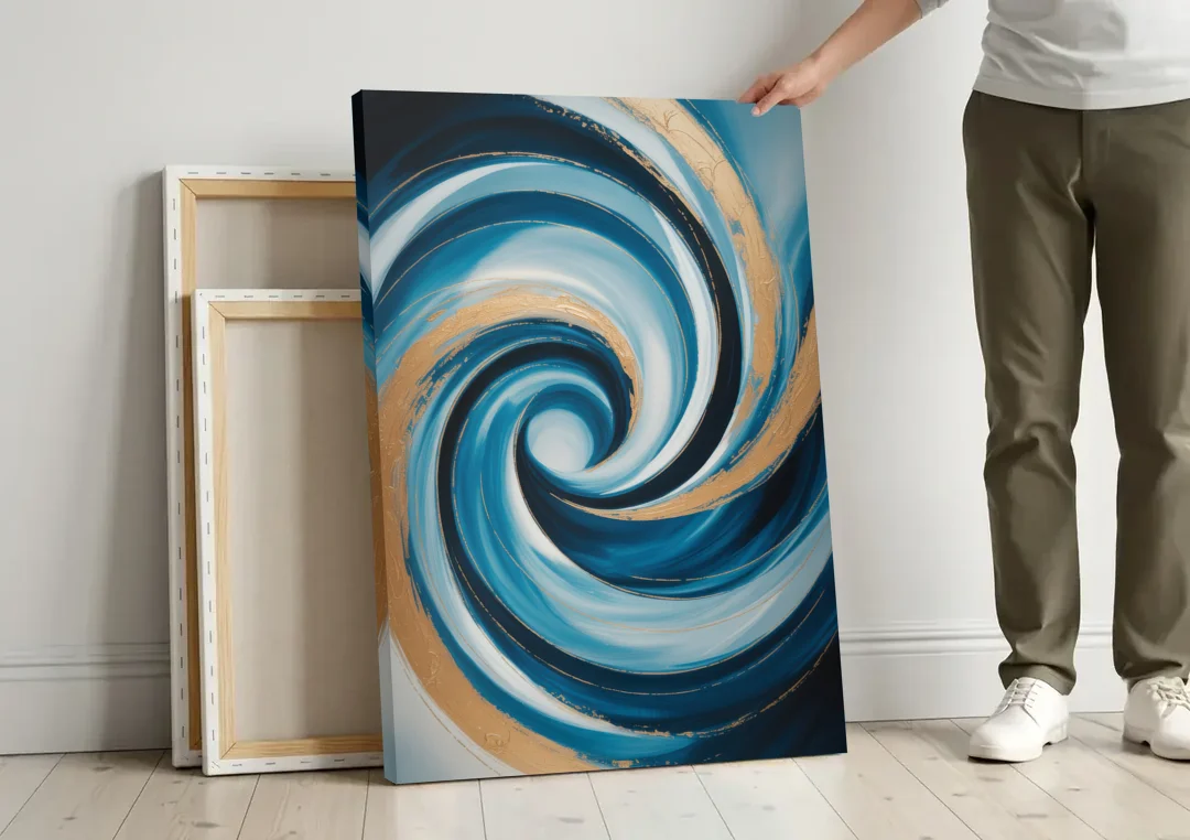 Opulent Swirl Blue and Gold Abstract canvas wall art leaning against a wall next to blank canvases