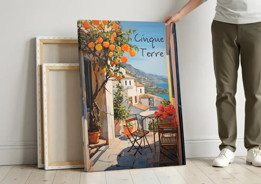 Orange Tree Painting on a Cinque Terre Terrace canvas wall art leaning against a wall next to blank canvases