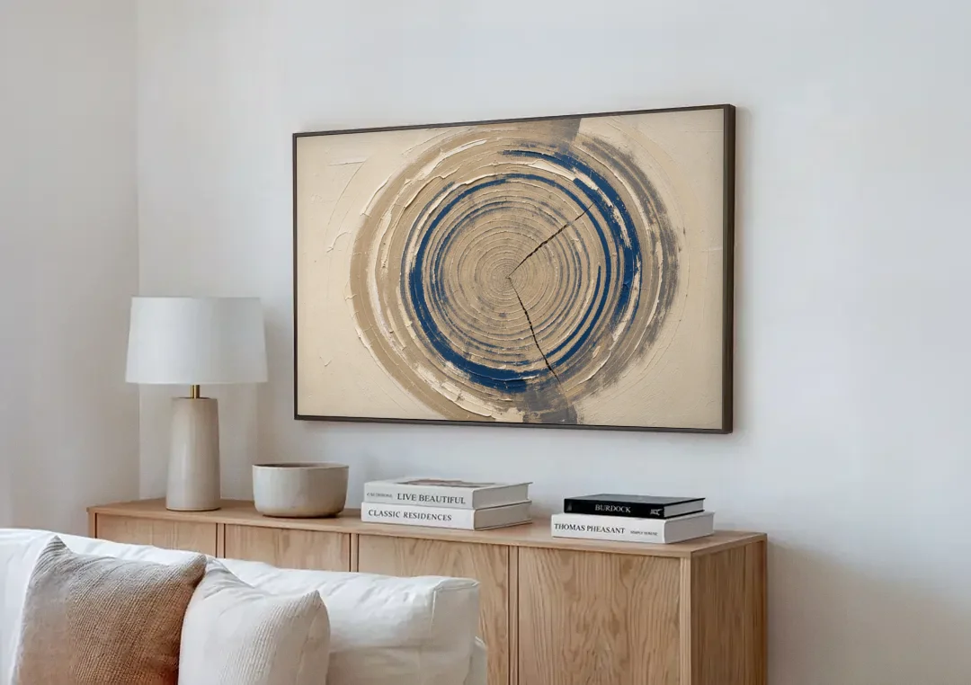Organic Abstract Wall Art of Navy Tree Rings canvas wall art above a wooden sideboard next to a sofa