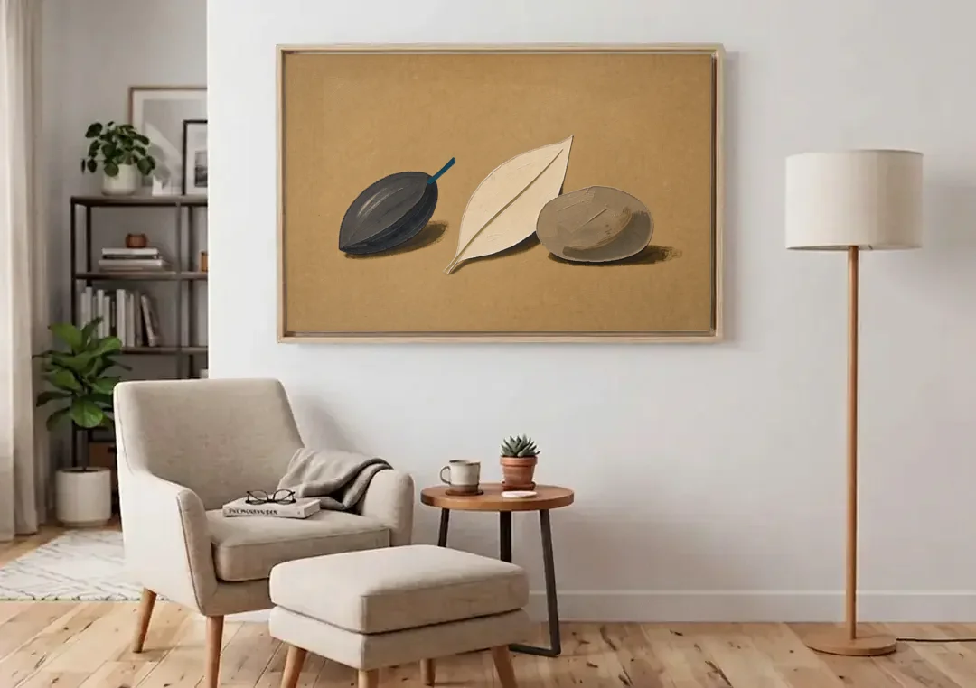 Organic Modern Home Decor with Seed, Leaf and Pebble canvas wall art above an armchair in a bright living room