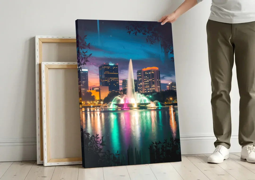 Orlando Downtown Night Lights canvas wall art leaning against a wall next to blank canvases