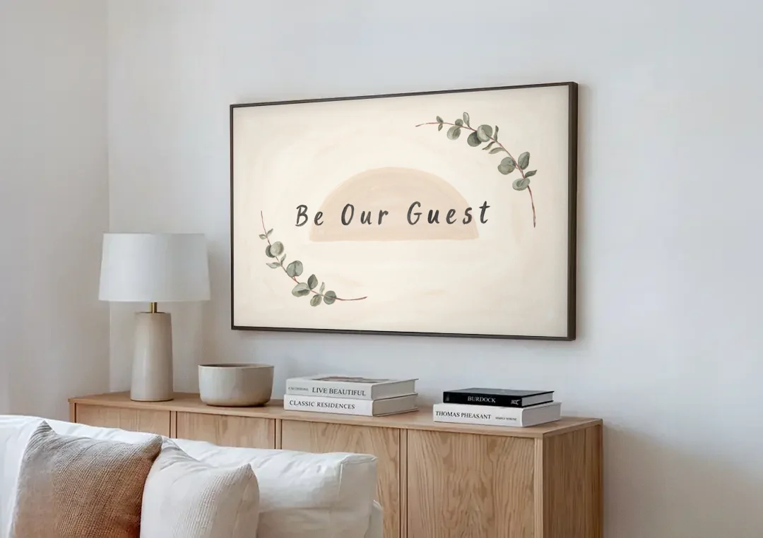 Over the Bed Wall Art Be Our Guest Eucalyptus canvas wall art above a wooden sideboard next to a sofa