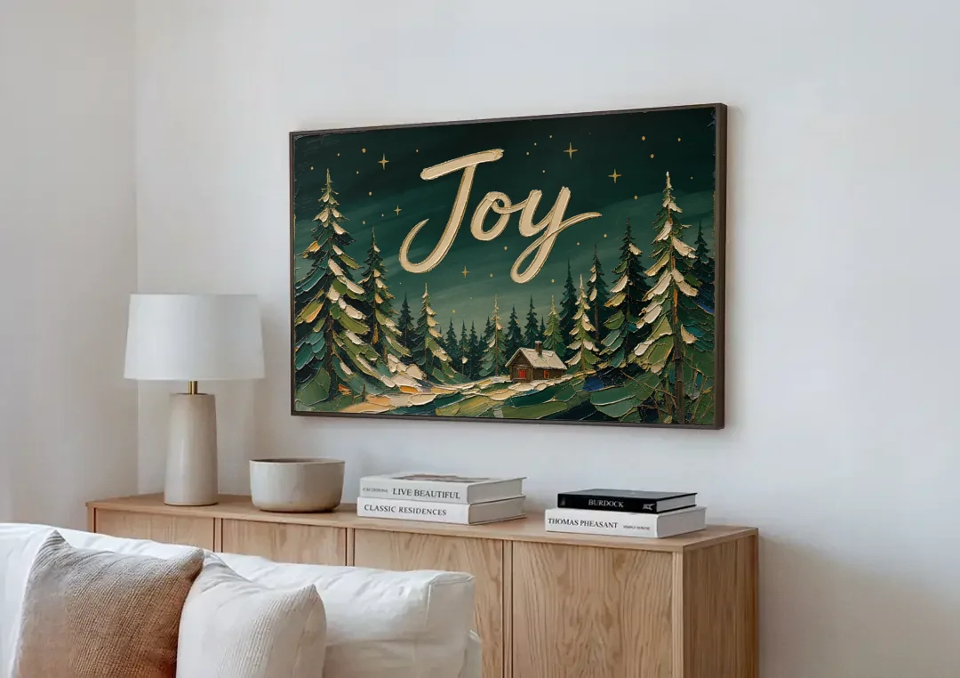 Oversized Christmas Canvas of Joy Over Snowy Pines canvas wall art above a wooden sideboard next to a sofa
