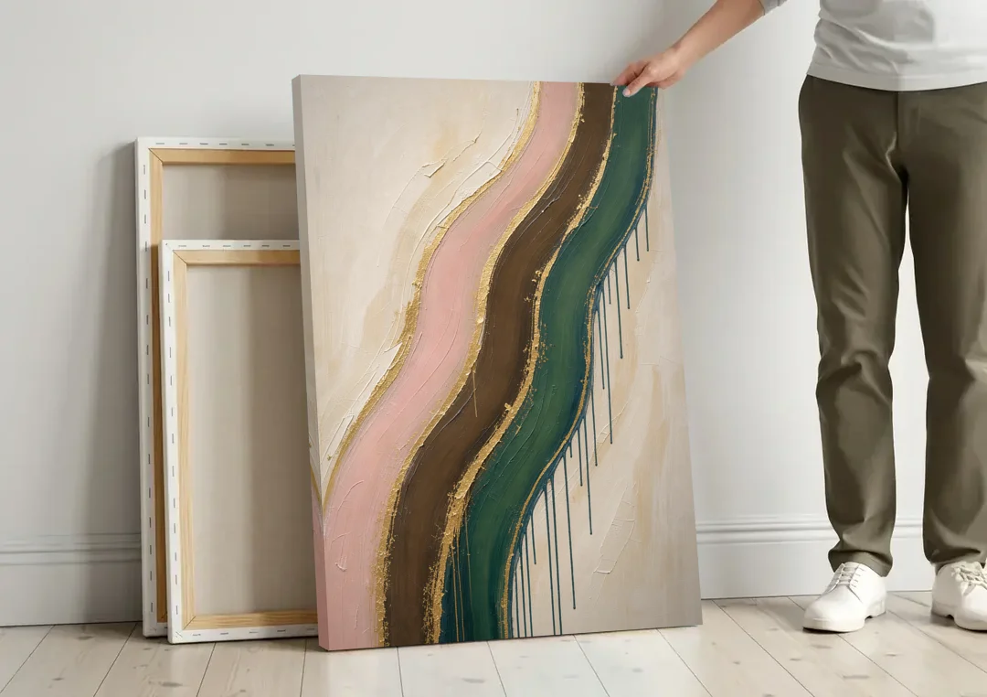 Oversized Textured Gilded Ribbon Drift canvas wall art leaning against a wall next to blank canvases
