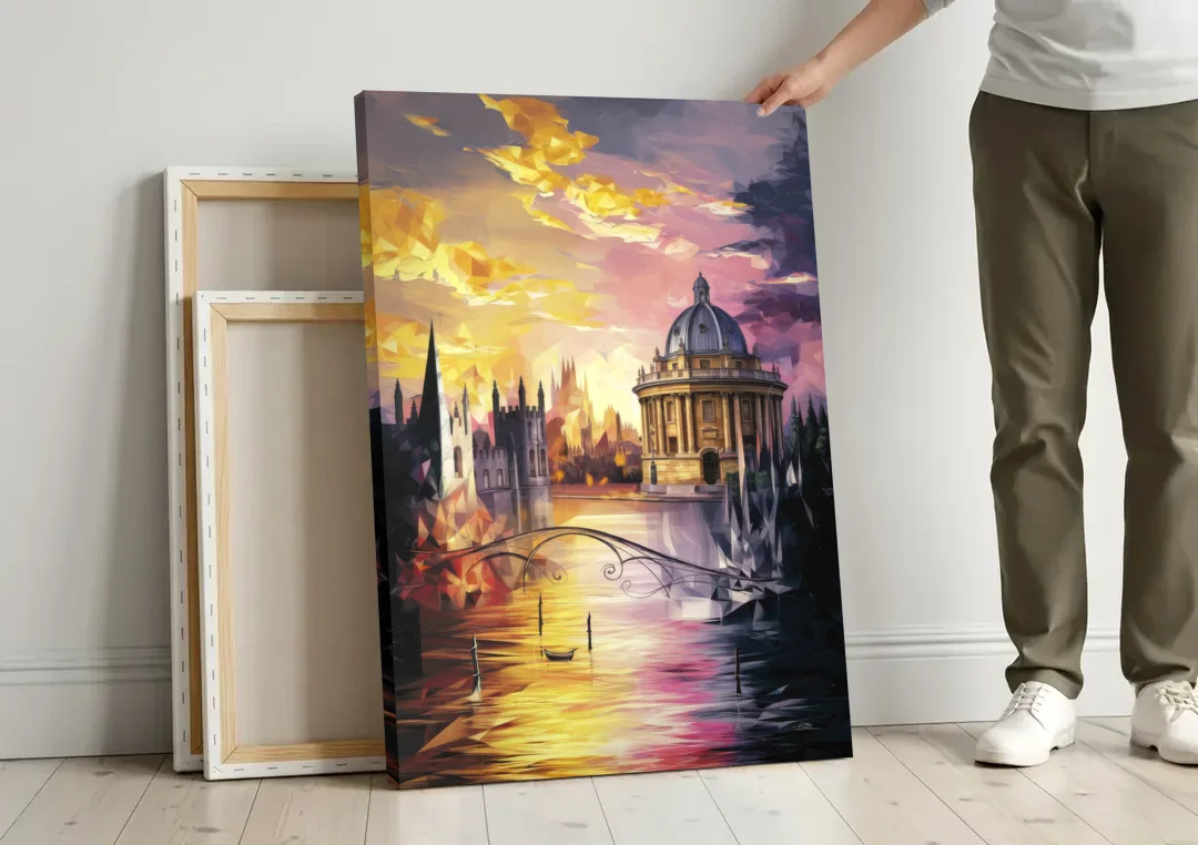 Oxford Cityscape Sunset canvas wall art leaning against a wall next to blank canvases