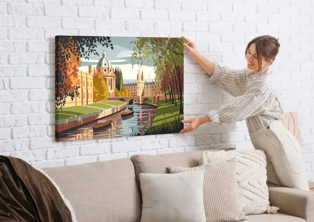 Oxford River Thames View canvas wall art being hung on a white brick wall above a sofa