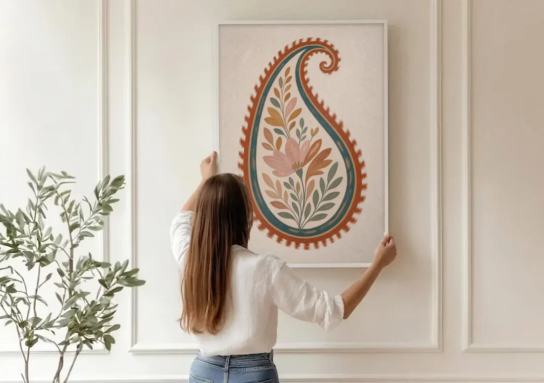 Paisley Wall Art with an Ikat Feathered Bloom canvas wall art being hung on a paneled wall