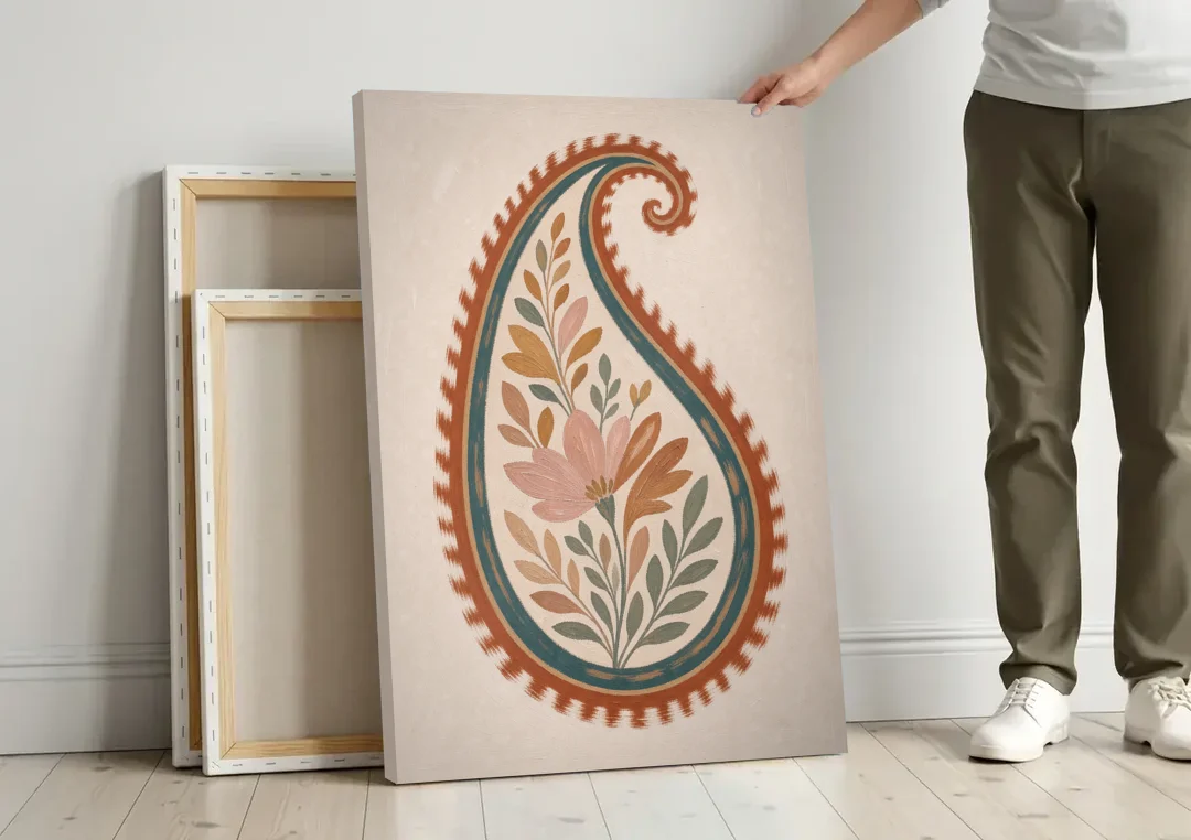 Paisley Wall Art with an Ikat Feathered Bloom canvas wall art leaning against a wall next to blank canvases