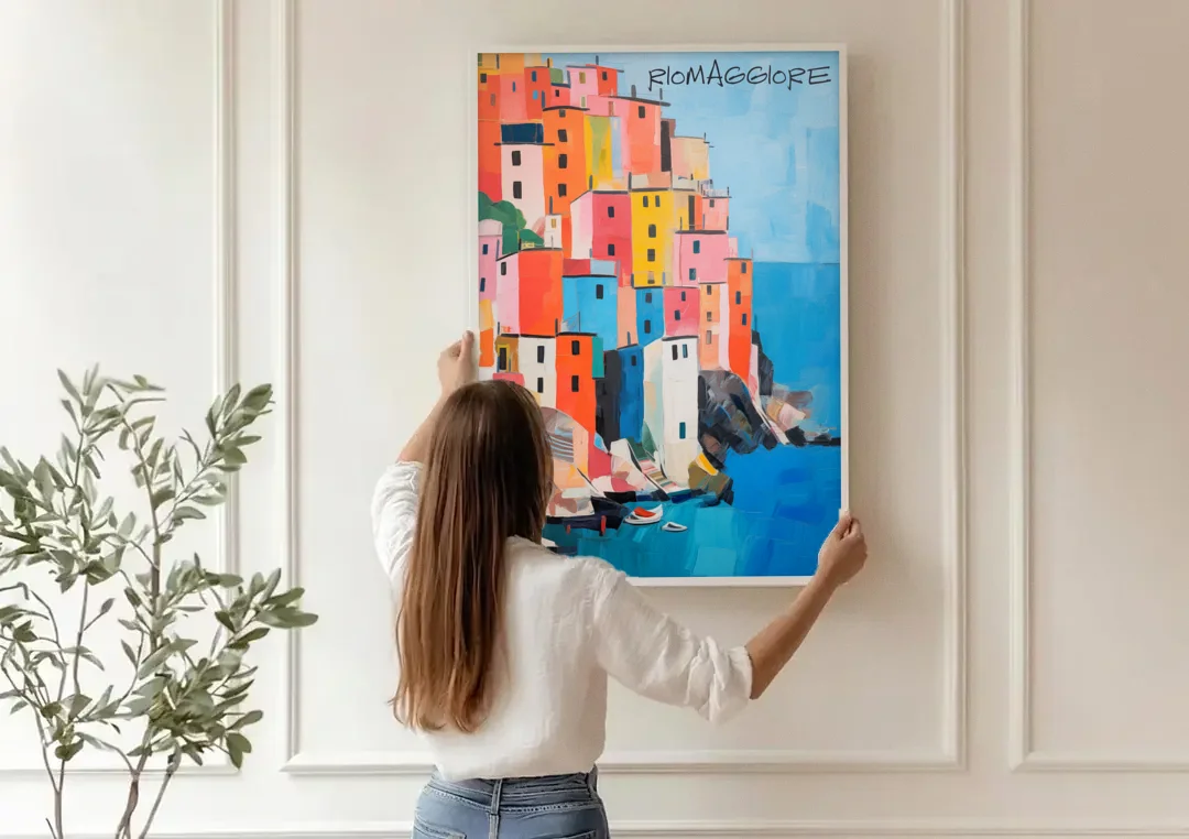 Palette Knife Painting of Riomaggiore canvas wall art being hung on a paneled wall