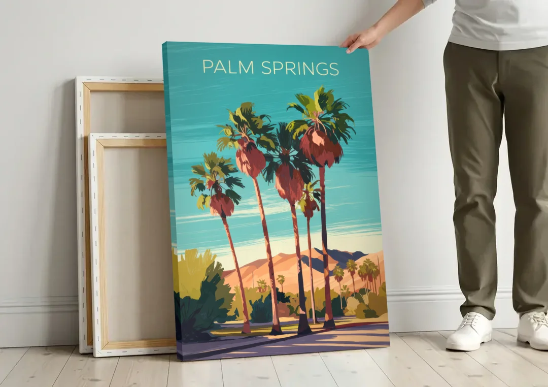 Palm Springs Palm Trees and Sky canvas wall art leaning against a wall next to blank canvases