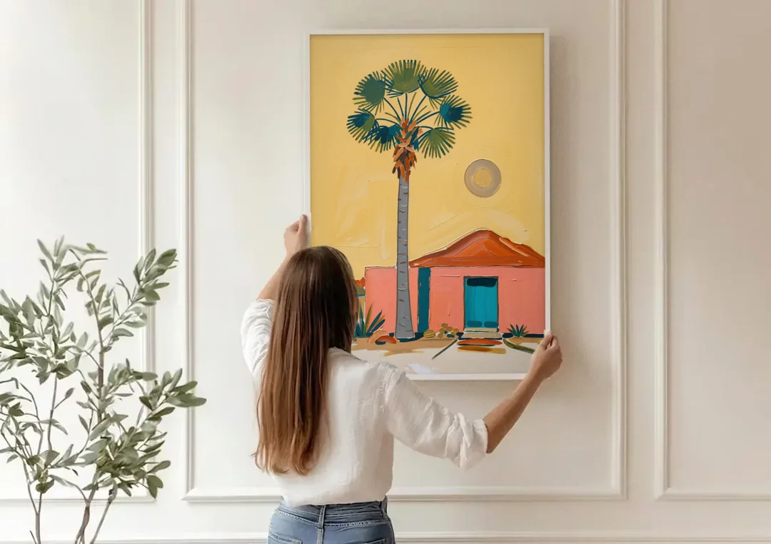 Palm Springs Wall Art with Fan Palm and Casita canvas wall art being hung on a paneled wall