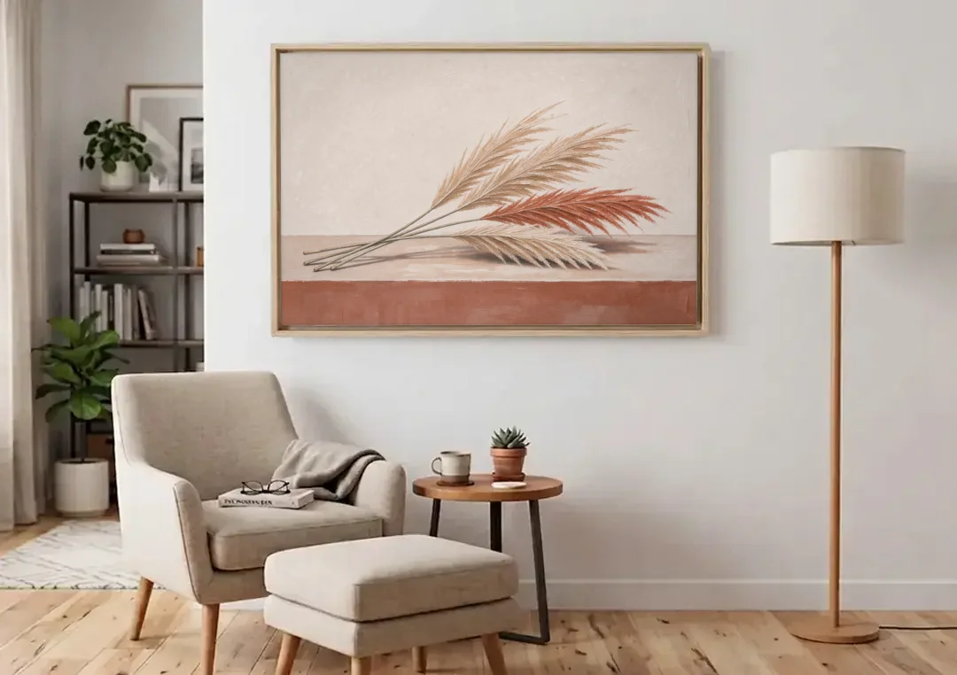Pampas Grass Wall Art with Three Resting Plumes canvas wall art above an armchair in a bright living room