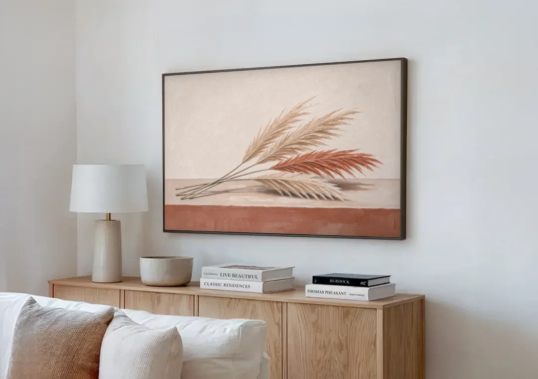 Pampas Grass Wall Art with Three Resting Plumes canvas wall art above a wooden sideboard next to a sofa