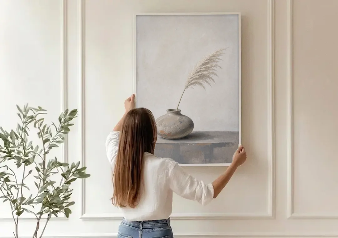 Pampas Plume in a Round Stoneware Vase canvas wall art being hung on a paneled wall