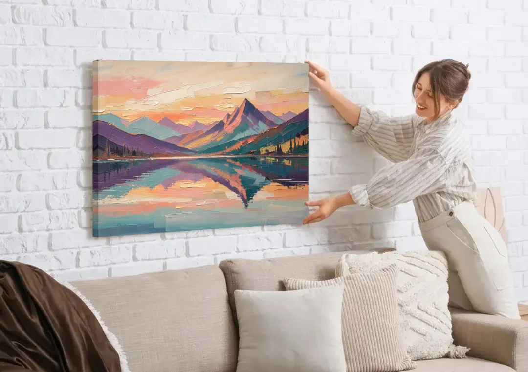 Panoramic Alpine Lake Sunset Peak canvas wall art being hung on a white brick wall above a sofa