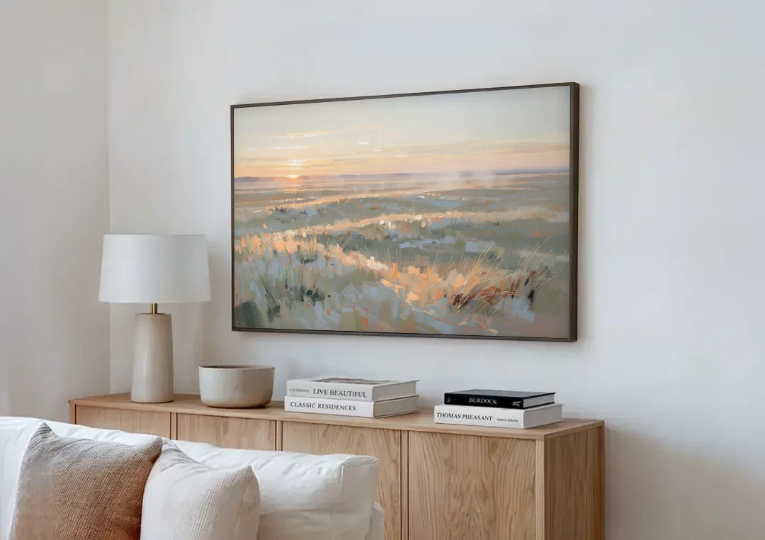 Panoramic Landscape Wall Art of Dawn Over Prairie Grass canvas wall art above a wooden sideboard next to a sofa