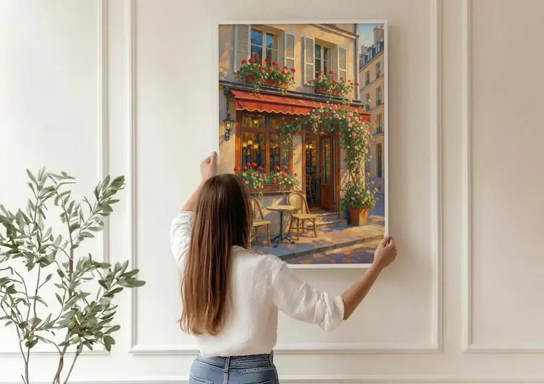 Paris Cafe Painting with Geraniums and Climbing Rose canvas wall art being hung on a paneled wall