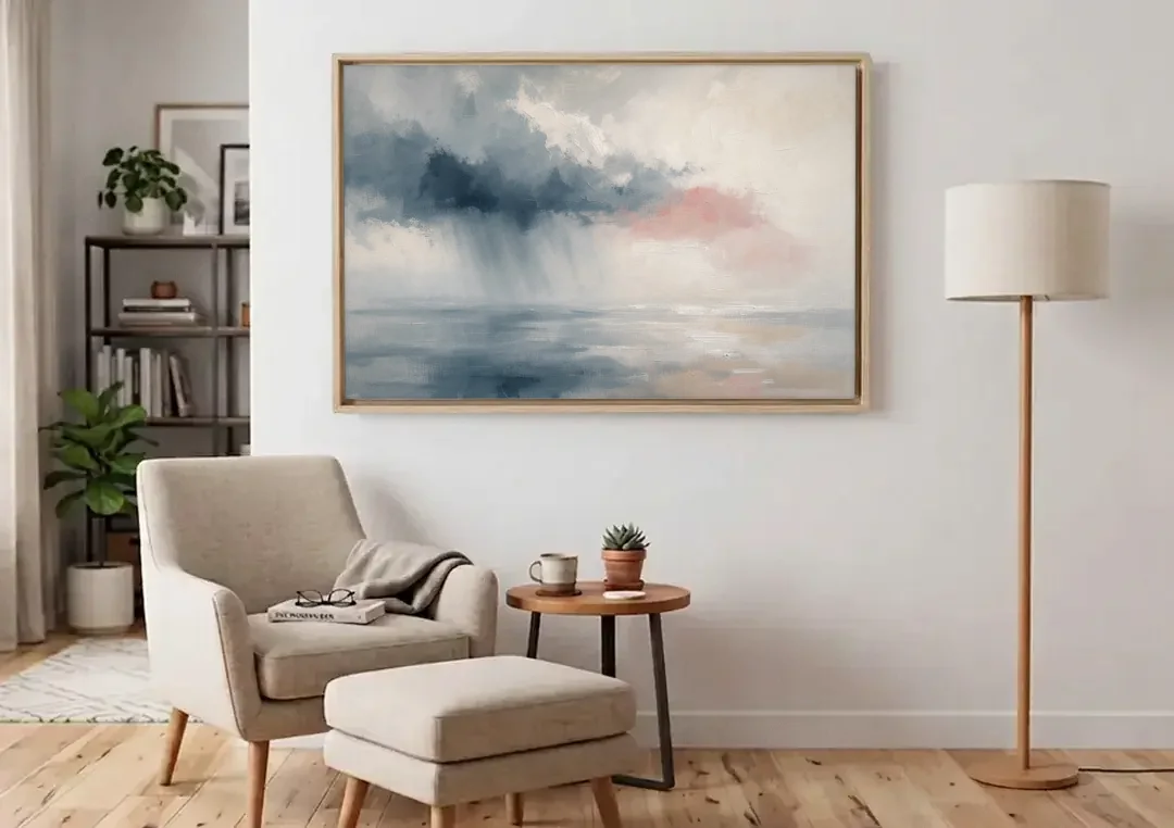 Passing Rain Over a Calm Sea Above the Headboard canvas wall art above an armchair in a bright living room