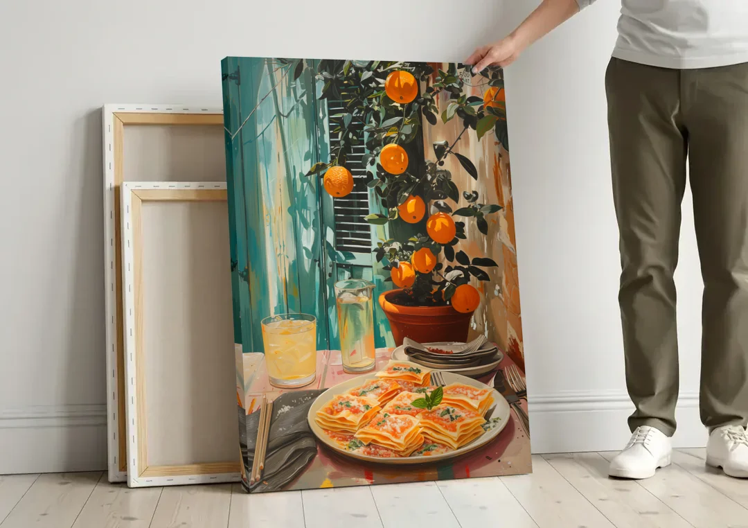 Pasta Painting of Lasagna Under Oranges canvas wall art leaning against a wall next to blank canvases
