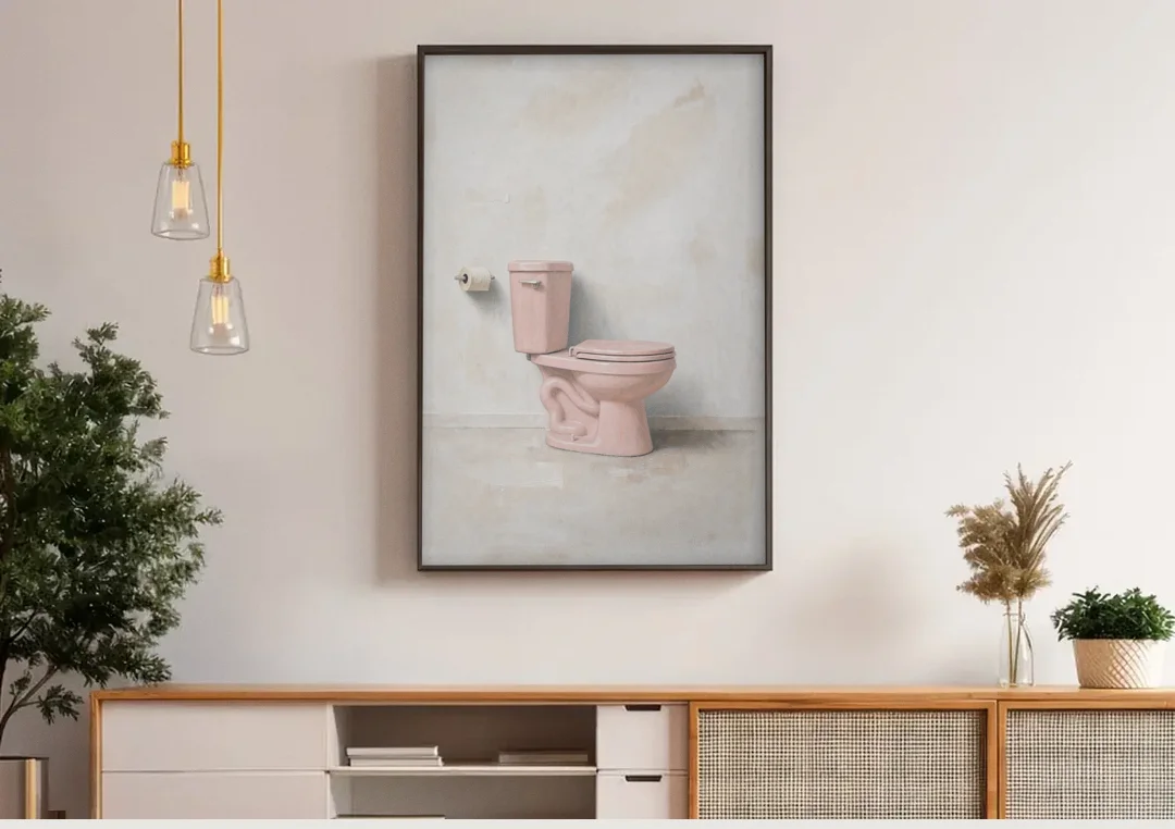 Pastel Bathroom Decor with a Pink Toilet in Profile canvas wall art above a wooden sideboard under pendant lights