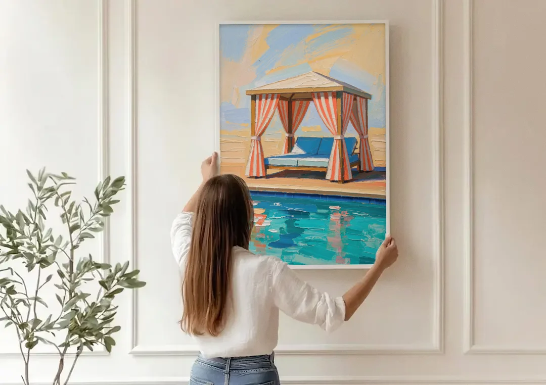 Patio Wall Art Coral Striped Cabana by the Pool canvas wall art being hung on a paneled wall