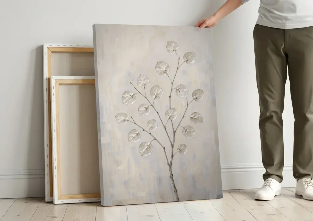 Peaceful Bedroom Art of a Silver Honesty Branch canvas wall art leaning against a wall next to blank canvases
