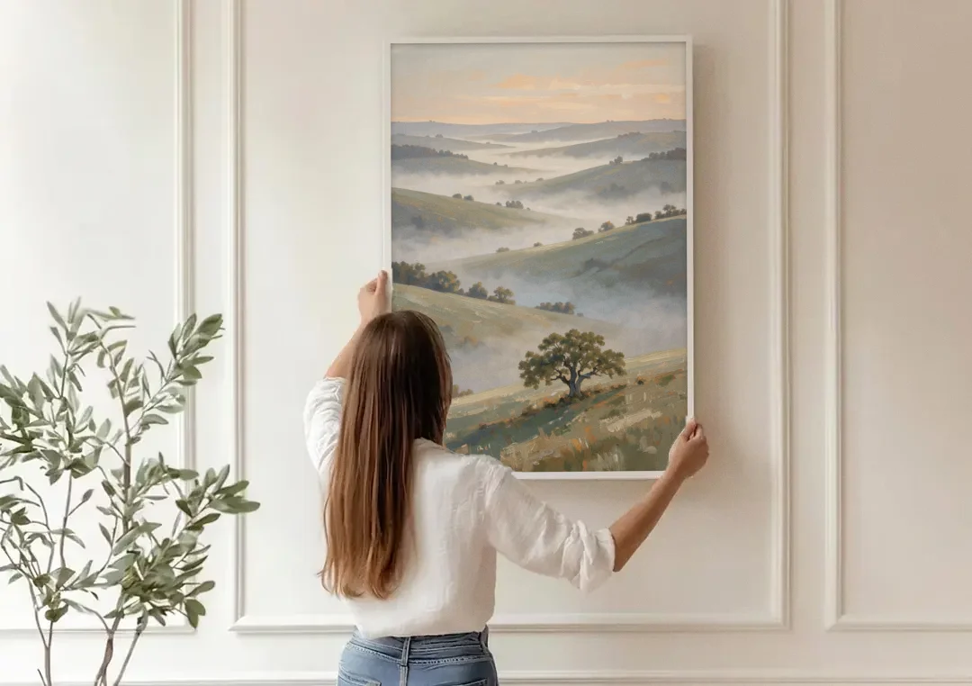 Peaceful Landscape Painting of Misty Hills and Oak canvas wall art being hung on a paneled wall